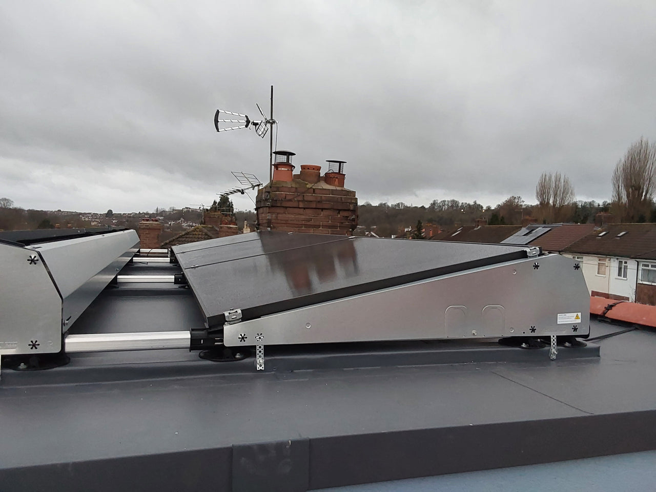 Close-up of solar panel installation on flat roof