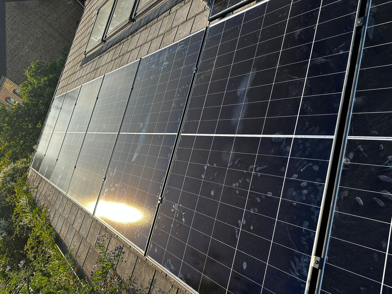 Close-up of solar panels on a roof in SW11 2BQ