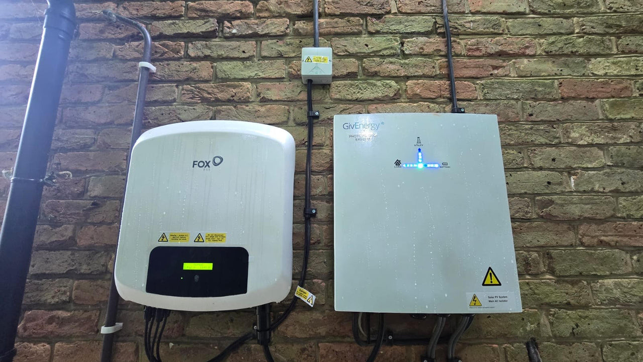 Givenergy and Fox inverters on brick wall